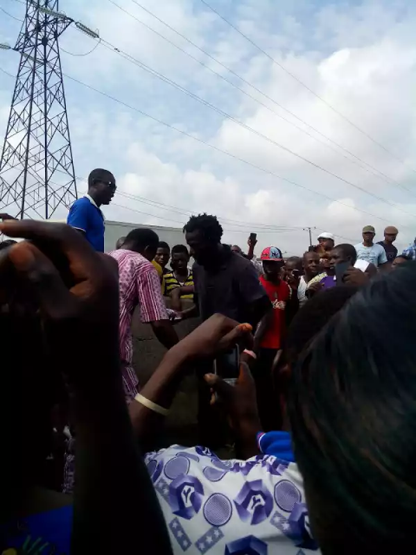 Real? Pastor Heals Mad Man On The Street Of Lagos [See Photos]